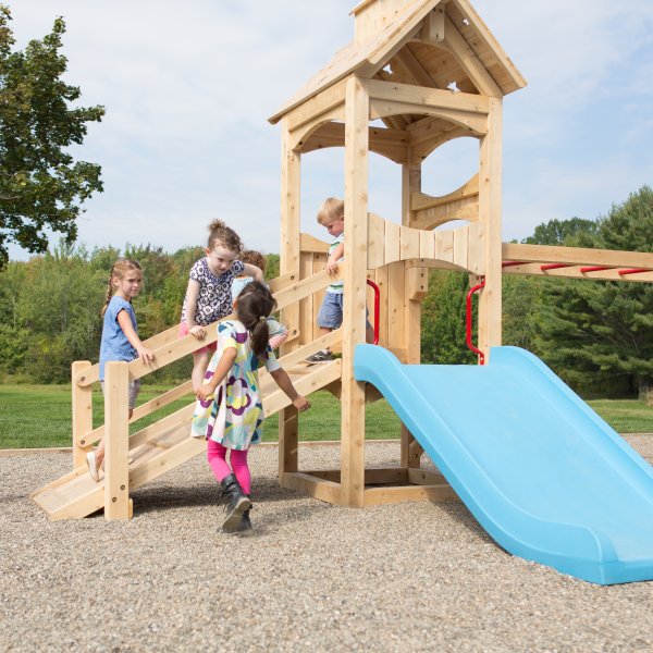Children playing on a commercial outdoor playset