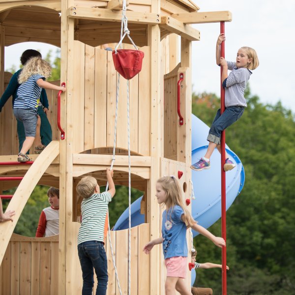 Kids playing on a commercial outdoor playset